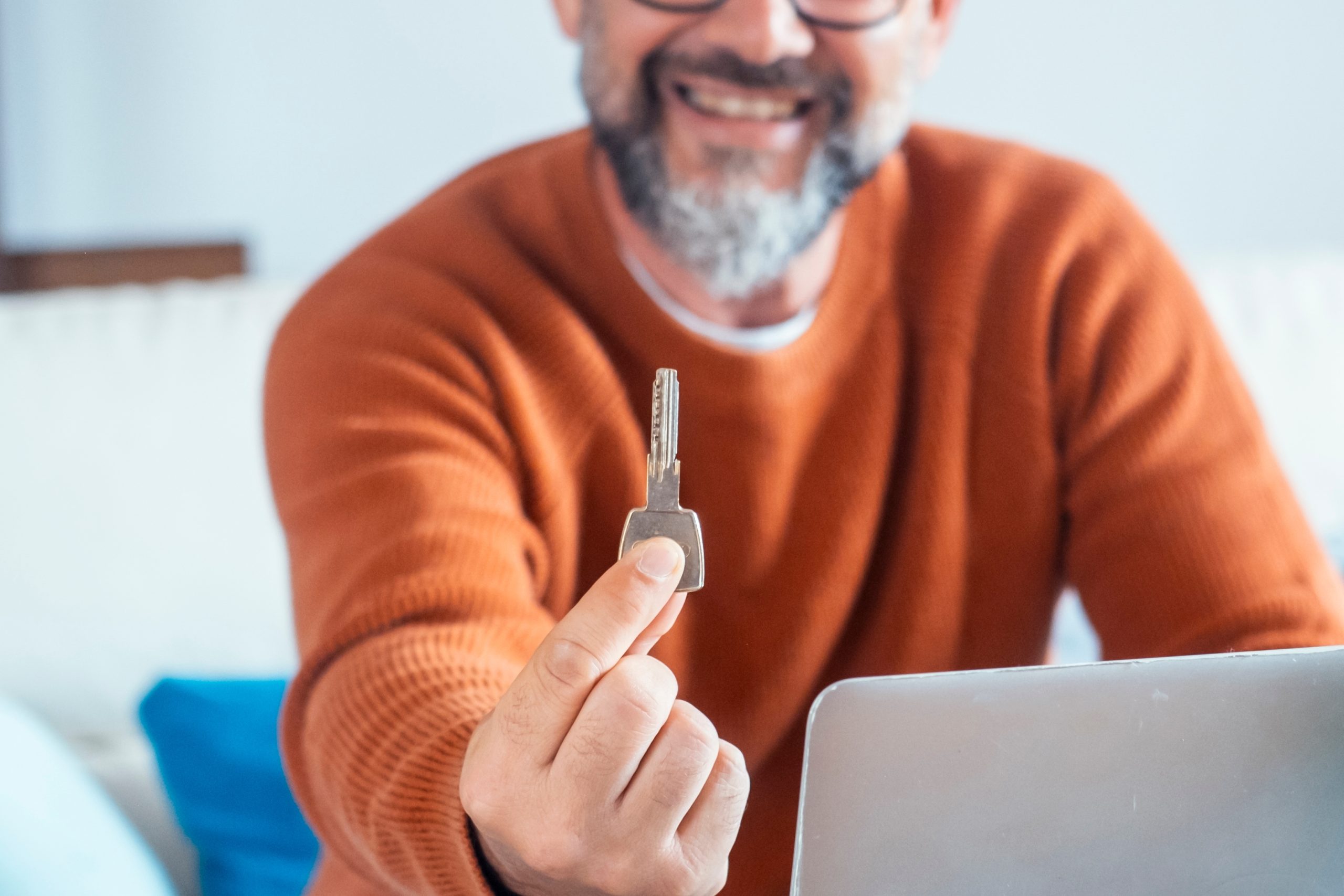 First-time homebuyer in Coeur d'Alene Idaho receiving house keys from real estate agent